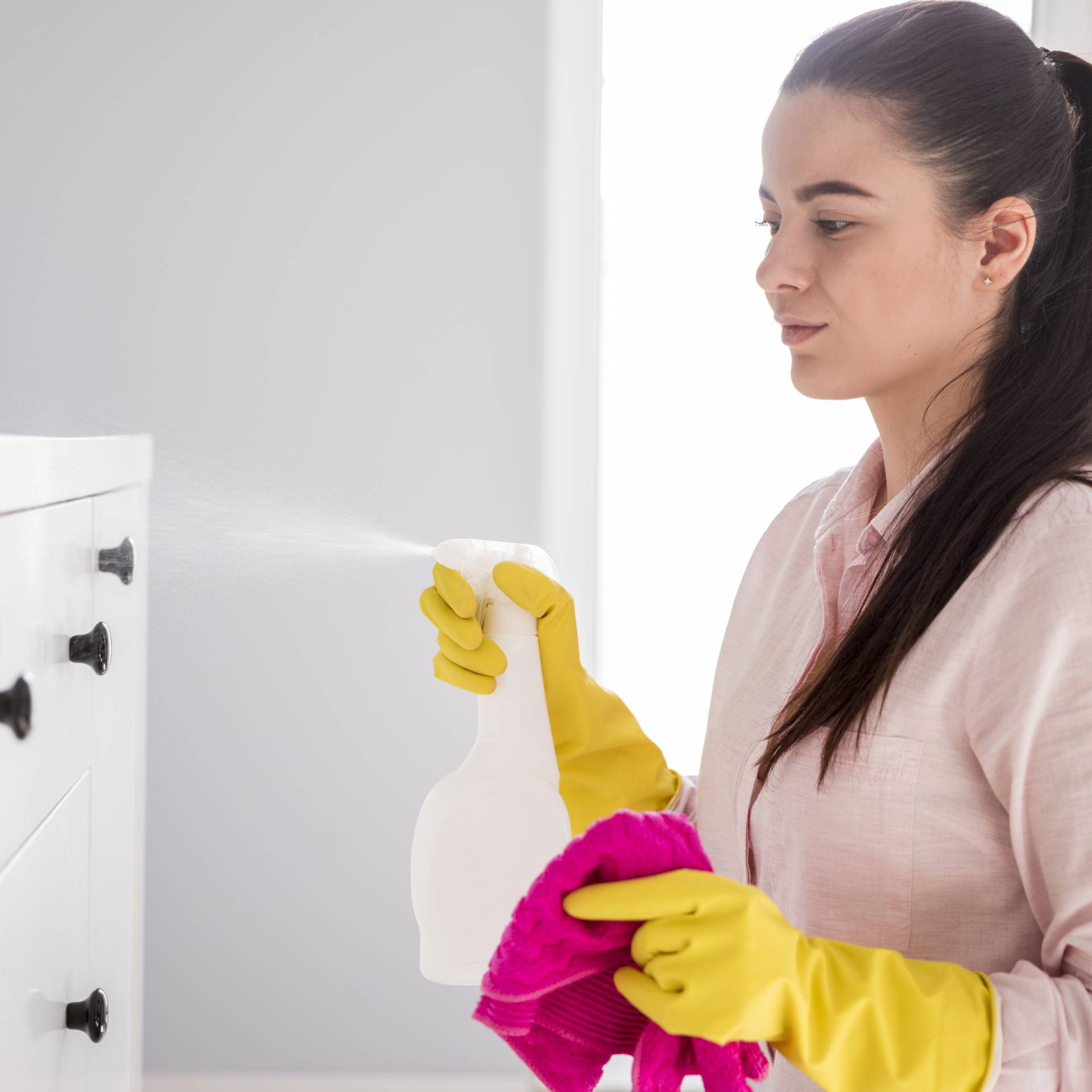 Woman cleaning her home